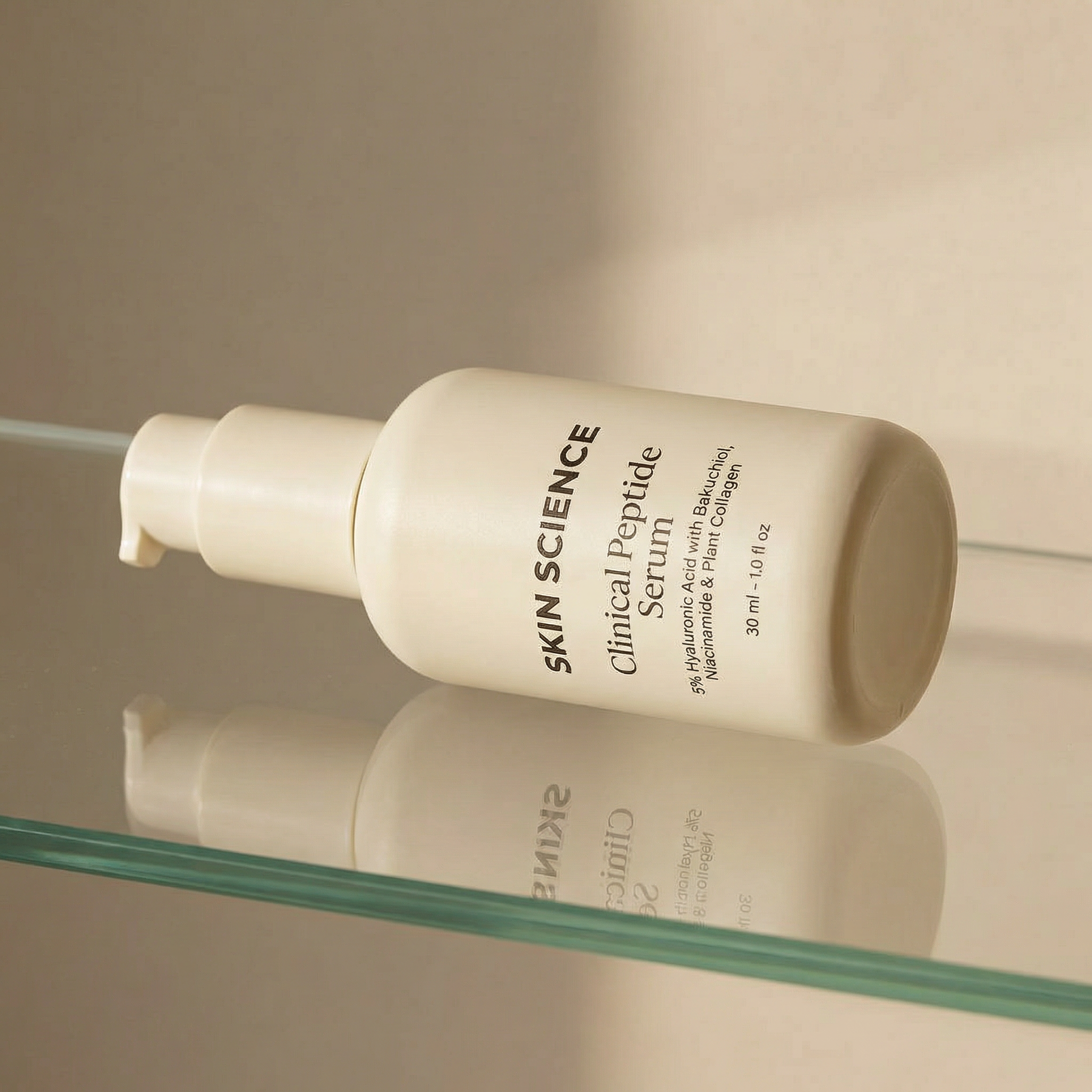 Skin Science Clinical Peptide Serum bottle on a reflective surface with a neutral background